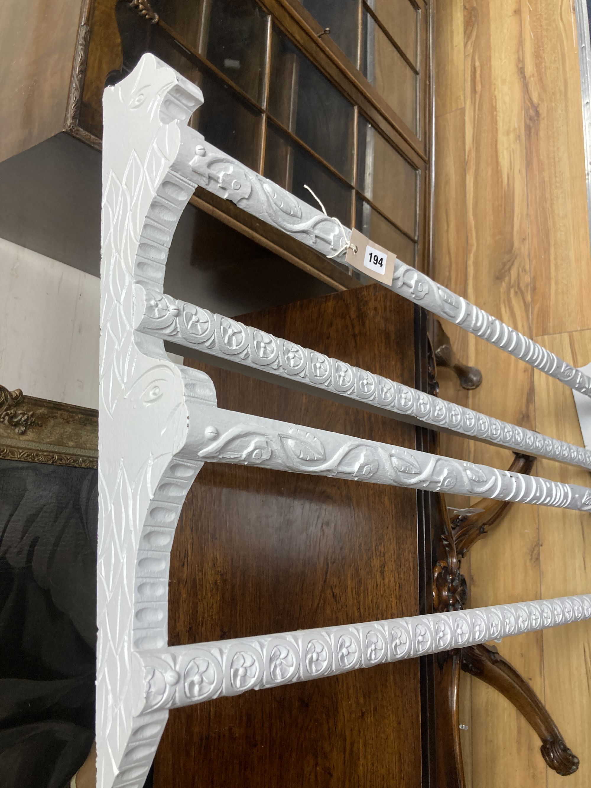 A 19th century carved painted wood plate rack, length 122cm, height 56cm